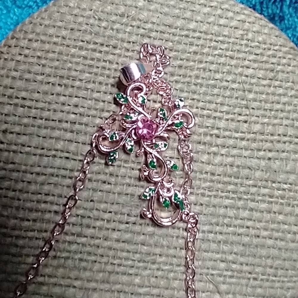 Goldtone pink stone green leaves scroll Christian Catholic cross chain necklace